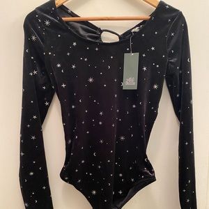 Brand new never worn. Black stars long sleep bodysuit